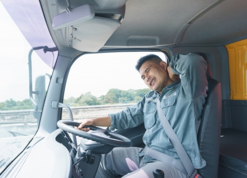 A tired driver in a cab